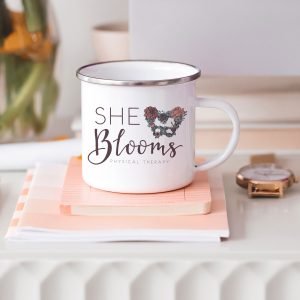 She Blooms full color logo on camp coffee mug
